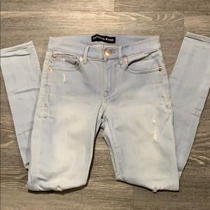 Express light wash jegging with rose gold detail